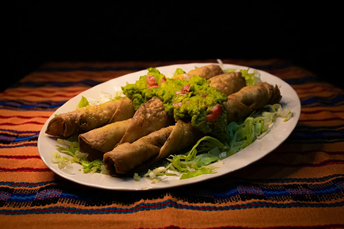 Flautas with guacamole and lettuce