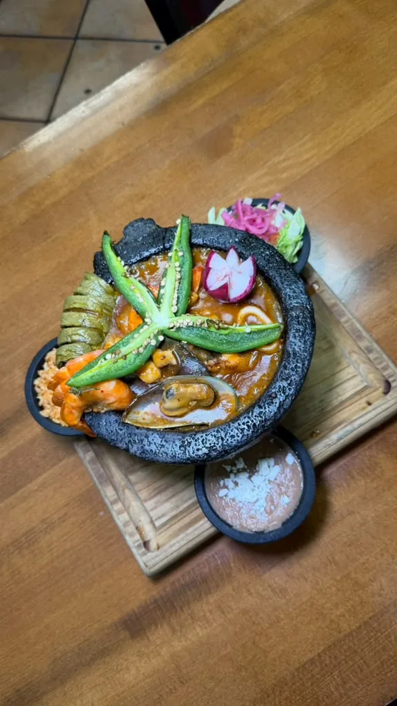 Seafood molcajete with shrimp, a mussel and grilled peppers
